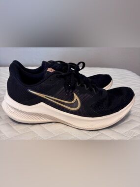 Nike Women’s Black and Gold Sneakers